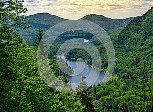 Awesome summer view from a verdant hill in Jacques Cartier National Park, Quebec province, Canada