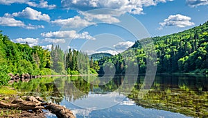 Awesome summer view from a verdant hill in Jacques Cartier National Park, Quebec province, Canada