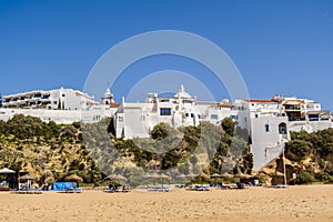 Awesome view of Albufeira whitewashed houses on cliff, Praia dos Pescadores, Albufeira, Portugal photo