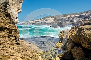 Awesome view on rocky beach between two rocks