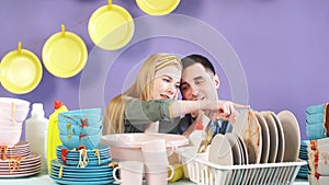 Awesome young couple dreaming about washing machine