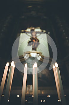 Awestruck catholic church in Italy with electric candles