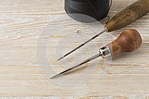 Awl thread hook and a Shoe on the table