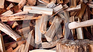 Ax on the background of firewood in the village, copy space for text. Hardwood