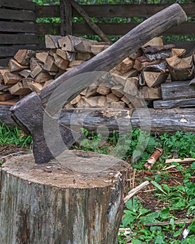 Ax on the background of a wood warehouse