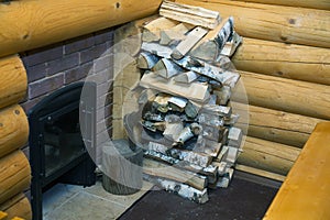 Ax and pile of split wood