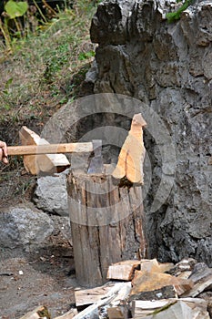 Axe in action cutting wood