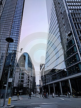 Axe building in the center of London surrounded with modern buildings during winter with a cloudy sky