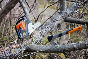 An axe and chainsaw