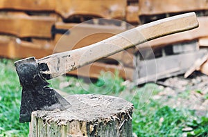 Axe in a log