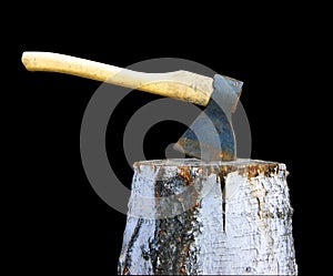 Axe and log on black background