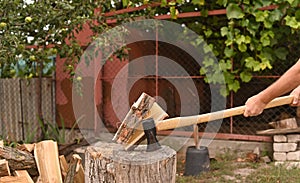 The axe split the log in two.