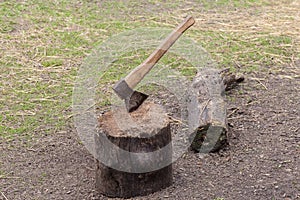 Axe thrust in wood block on a courtyard