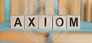 AXIOM word made with building blocks on a blue background