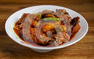 Ayam masak merah is a Malaysian traditional dish photo