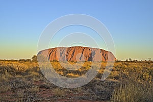 Ayers Rock or Uluru respectively at sun set