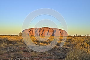 Ayers Rock or Uluru respectively at sun set