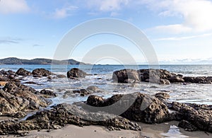 View of Pacific Ocean from a rocky beach photo