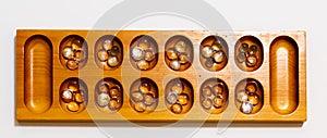 Ayo Olopon. Some call it Mancala. A Yoruba Nigerian brain game.