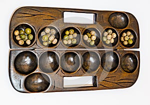 Ayo Olopon. Some call it Mancala. A Yoruba Nigerian brain game.