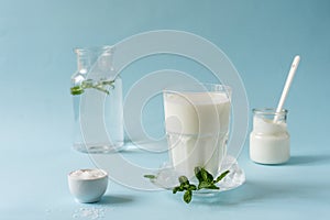 Ayran or Doogh is a popular refreshing Middle Eastern beverage made with yogurt, water and salt. Blue background