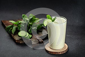 Ayran or Doogh is a popular refreshing yogurt on a dark background. Restaurant menu, dieting, cookbook recipe top view