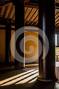 Ays of light inside an ancient Buddhist temple in Tokyo Japan.