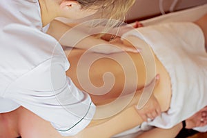 Ayurveda beck and shoulder blade massage with ayurvedic oil, girl massaging a girl, Concept of relaxation and body care. Close up