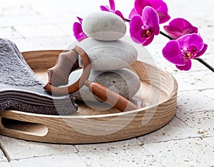 Ayurveda and mindfulness for calming body massage over balancing stones photo