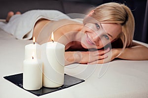 Ayurvedic relaxing.health beauty happy blonde woman in spa salon getting massage .Beautiful girl enjoying day spa resort