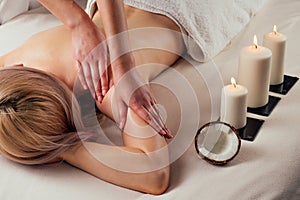 Ayurvedic relaxing.health beauty happy blonde woman in spa salon getting massage .Beautiful girl enjoying day spa resort