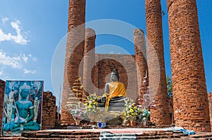 Old ruins of  Wat Thammikarat temple with sitting Buddha statue