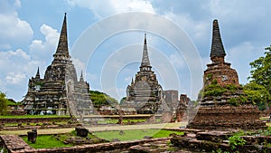 Ayutthaya, Thailand at Wat Phra Si Sanphet, couple men and women with a hat visiting Ayyuthaya Thailand