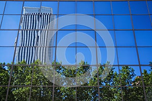 Azca reflection in building photo