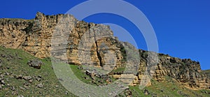 Azerbaijan. Beautiful spring mountains. Old caves in the rock