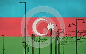 Azerbaijan flag with tram connecting on electric line with blue sky as background, electric railway train and power supply lines