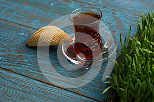 Azerbaijan pastry shekerbura with and glass of black tea