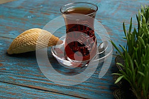 Azerbaijan pastry shekerbura with and glass of black tea