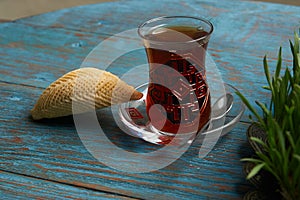 Azerbaijan pastry shekerbura with and glass of black tea