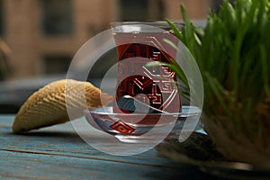 Azerbaijan pastry shekerbura with and glass of black tea