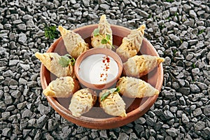 Azerbaijani Fried Dumplings Giurza with Minced lamb Meat also known as Gyoza