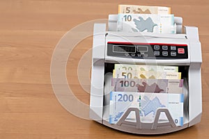 Azerbaijani Manat in a counting machine