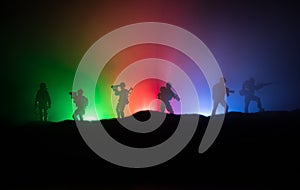 Azeri army concept. Silhouette of armed soldiers against Azerbaijani flag. Creative artwork decoration. Military silhouettes