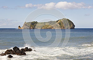 Azores coastline landscape with volcanic island. Ilheu da Vila.