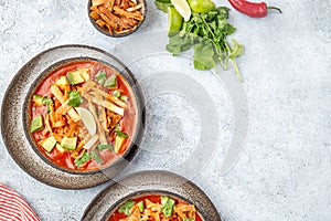 Aztec soup. Mexican sopa azteca with fried tortilla . Top view