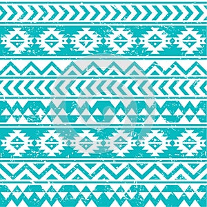 Aztec tribal seamless grunge white pattern on blue background photo