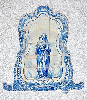 Azulejo tile in Porto, Portugal. Traditional portuguese ceramic decoration blue color. Historic building wall facade