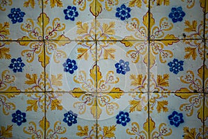 Azulejos ceramic tilework, traditional old tiles wall on the street