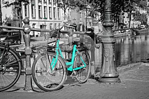 An azure bike on the streets of Amsterdam.
