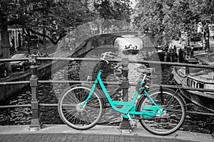 An azure bike on the streets of Amsterdam.